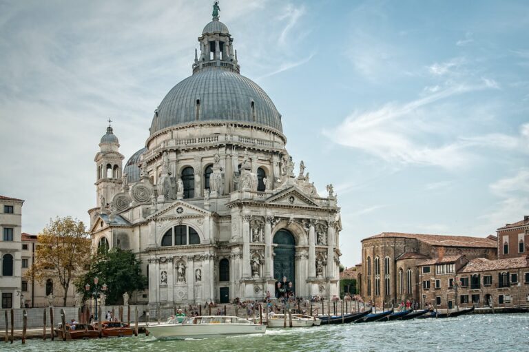 White and Gray Cathedral Under Cloudy Blue Sky during Daytime