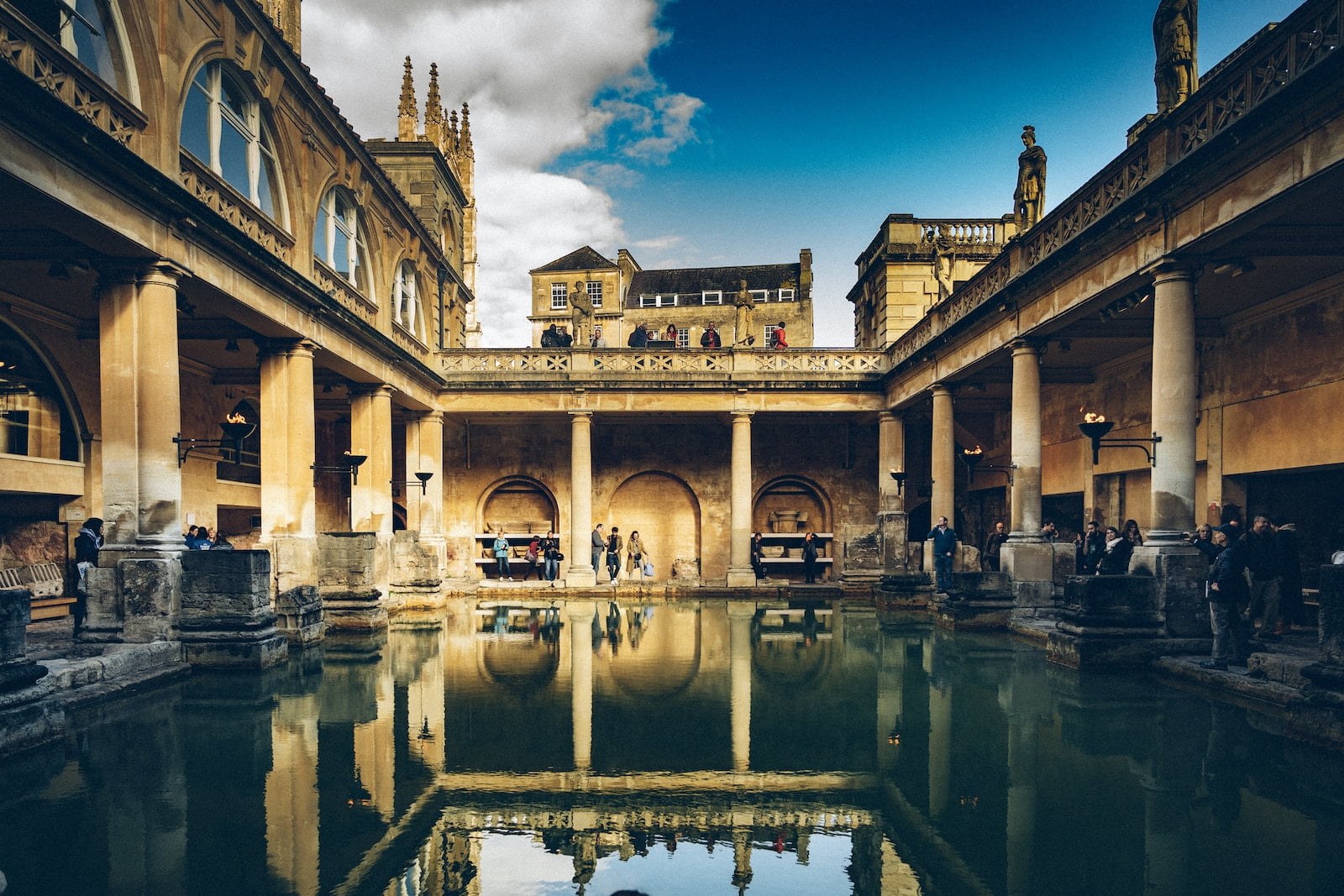 a large building with a pool in the middle of it